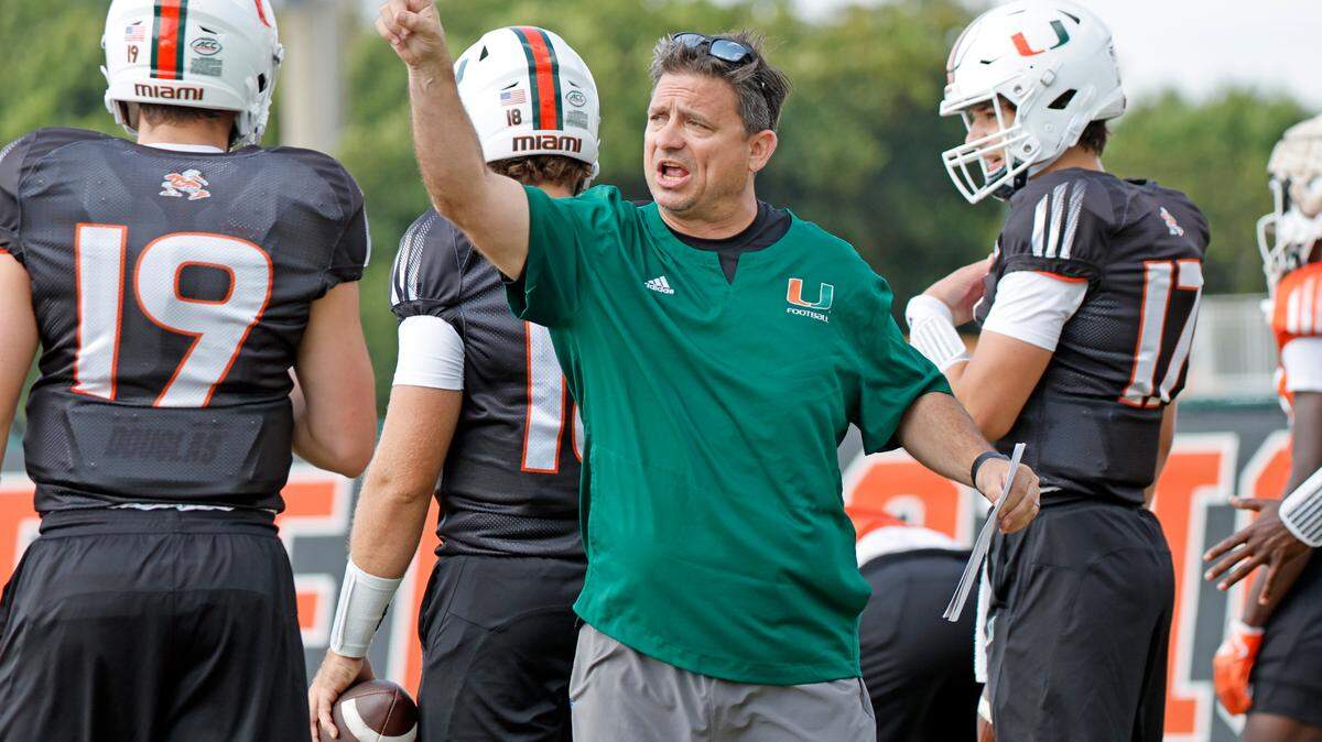 Miami Hurricanes offensive coordinator Shannon Dawson works with the quarterbacks during practice at the University of Miami’s Greentree Field on Thursday, March 9, 2023.