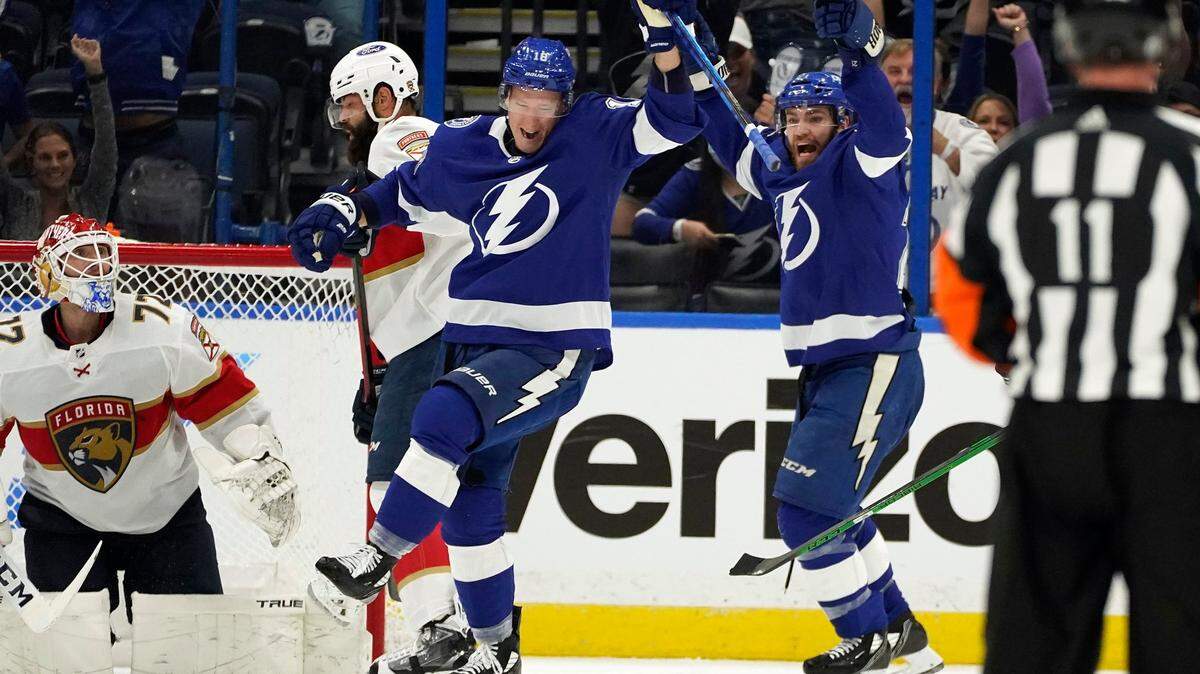 Tampa Bay Lightning left wing Ondrej Palat (18) celebrates after scoring past Florida Panthers goaltender Sergei Bobrovsky (72) during the first period in Game 4 of an NHL hockey Stanley Cup first-round playoff series Saturday, May 22, 2021, in Tampa, Fla. Looking on is center Brayden Point (21). (AP Photo/Chris O’Meara)