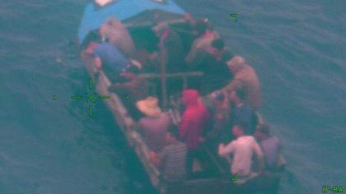 A photograph taken from a U.S. Coast Guard plane shows a Cuban migrant boat about 30 miles offshore of the Middle Florida Keys city of Marathon Thursday, June 2, 2022.