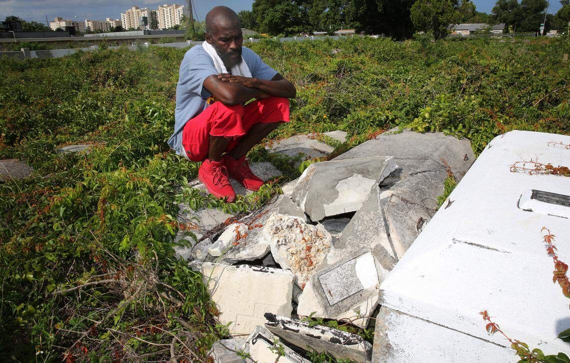 Arthur Kennedy, the caretaker at Lincoln Memorial Park examines damage to a grave at the cemetery. Kennedy stays on the property at night to keep vandals and grave robbers away. Nearby Evergreen Memorial Park Cemetery, was recently vandalized when graves were broken into and bones removed.