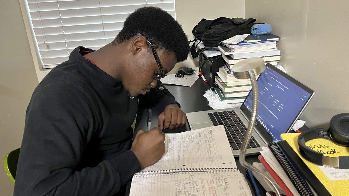 David Gaston, who is studying biomedical engineering at Miami Dade College, balances a full course load, including chemistry and calculus. 