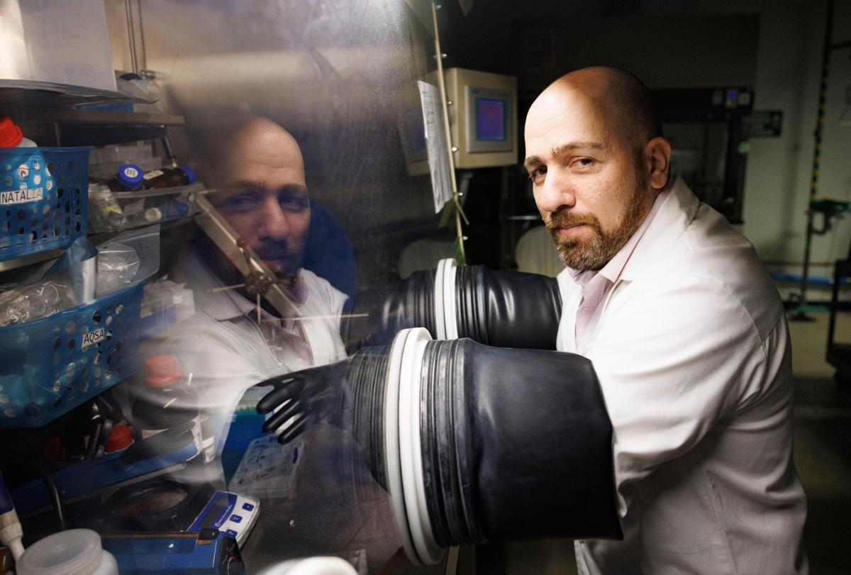 Dr. Bilal El-Zahab demonstrates using a chamber, without humidity or oxygen inside, where they assemble the batteries during a tour of the Battery Research Laboratory on Thursday, March 20, 2025, at the FIU Engineering Center in Miami, Fla. Dr. El-Zahab’s laboratory has created a Lithium-sulfur battery that could replace Lithium-ion rechargeable batteries.