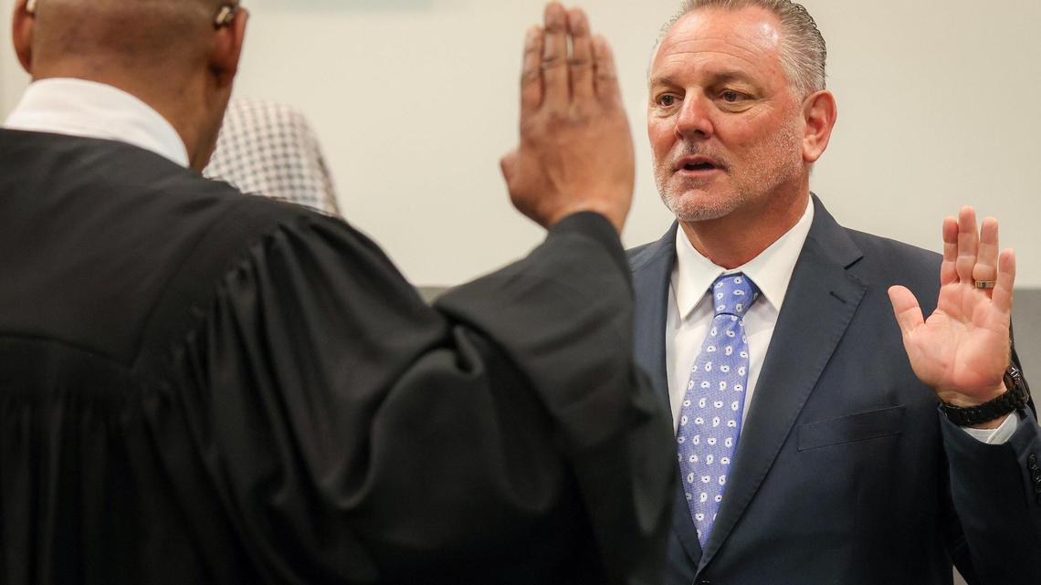Broward Circuit Judge Elijah H. Williams left, swears in Peter B. Licata, right, as the superintendent of Broward County Public Schools at the Kathleen C. Wright Administration Center’s boardroom in Fort Lauderdale, Florida on Tuesday, July 18, 2023. BCPS is the sixth-largest school district in the nation and the second-largest in the state of Florida.