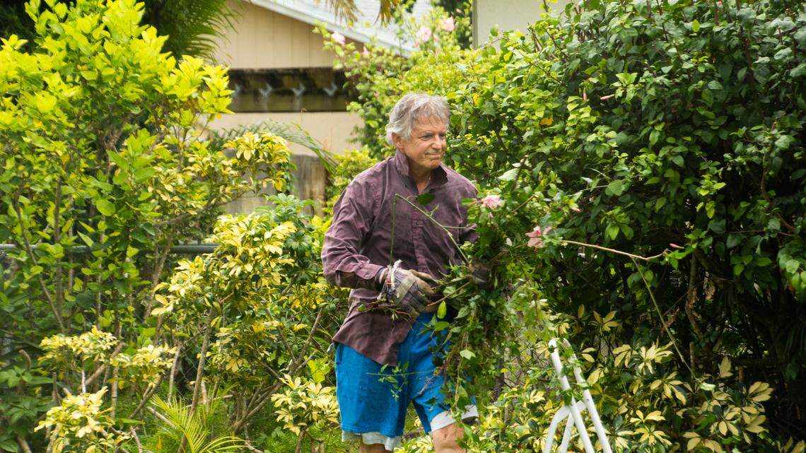 District 9 School Board Member Lawrence Feldman, 70, doing yard work at a home he and his wife own in West Kendall on Thursday, July 16, 2020. Feldman represents District 9 and West Kendall is not part of that district. Feldman’s voter registration records list his address as a 400-square-foot studio at the Monterey Gardens of Pinecrest.