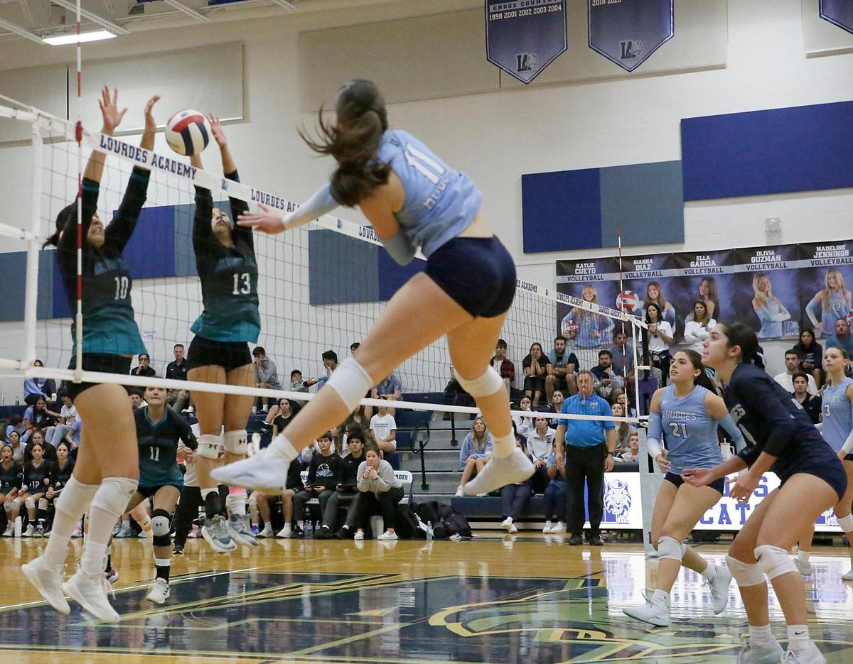 Our Lady of Lourdes Academy Bobcats Ella Garcia (11) spikes the ball against Archbishop McCarthy Mavericks during 2024 FHSAA Girls Volleyball State Championship on Wednesday, October 30, 2024 at Our Lady of Lourdes Academy in Miami. Andrew Uloza / for Miami Herald