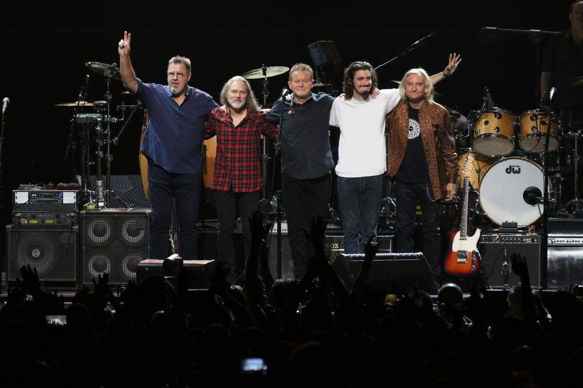 Eagles’ Vince Gill, Timothy B. Schmit, Don Henley, Deacon Frey and Joe Walsh take a bow on earlier dates of their “Hotel California Tour.” The 2022 trek includes several Florida dates.