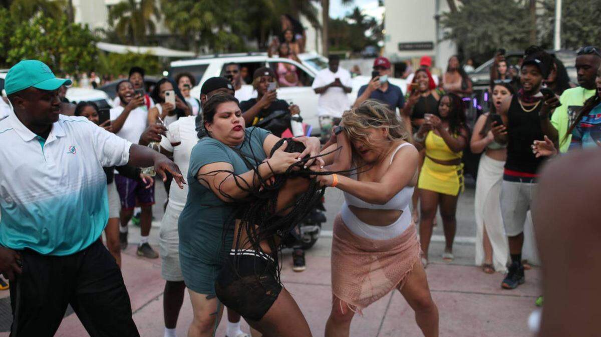 Two women fight near Ocean Drive in Miami Beach in March.