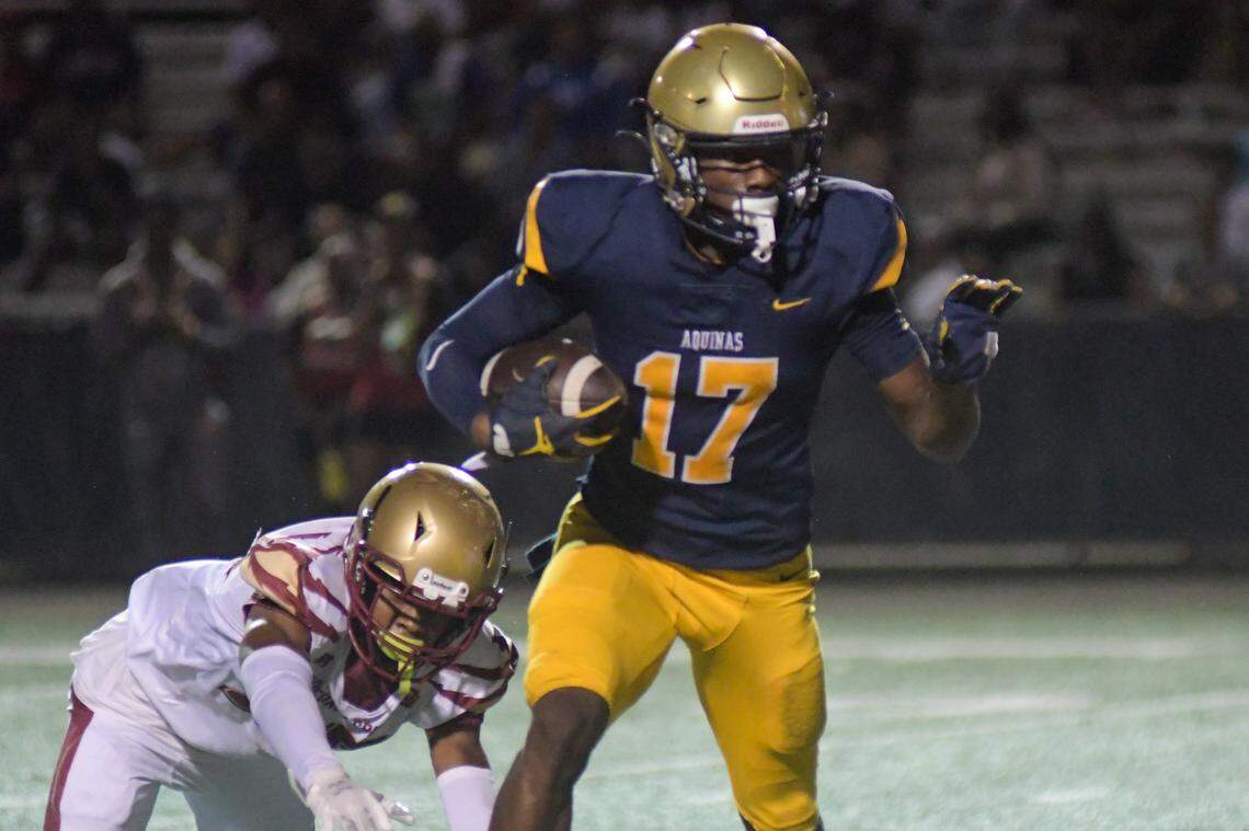 St. Thomas Aquinas wide receiver James Madison II runs for a touchdown in a Region 3-3M quarterfinal game against Coconut Creek on Friday, Nov. 11, 2022, at St. Thomas Aquinas High School in Fort Lauderdale, Florida.