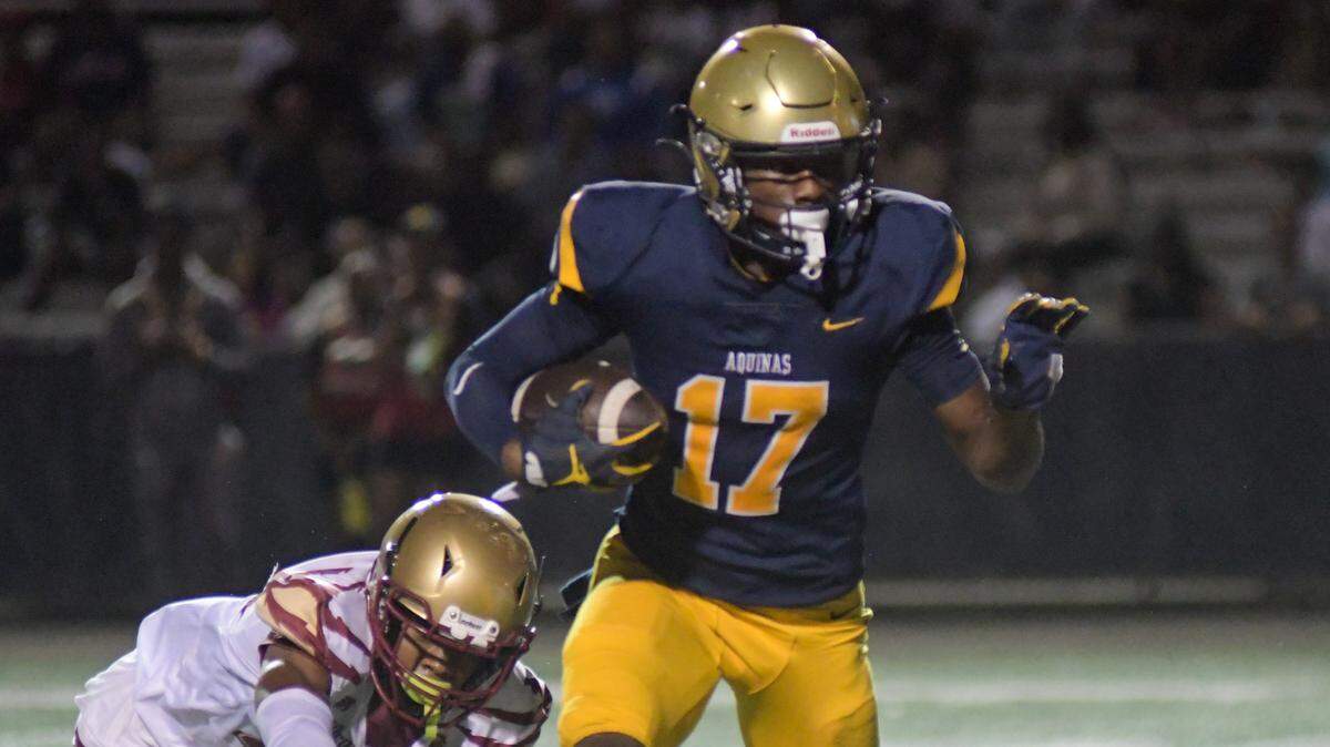 St. Thomas Aquinas wide receiver James Madison II runs for a touchdown in a Region 3-3M quarterfinal game against Coconut Creek on Friday, Nov. 11, 2022, at St. Thomas Aquinas High School in Fort Lauderdale, Florida.