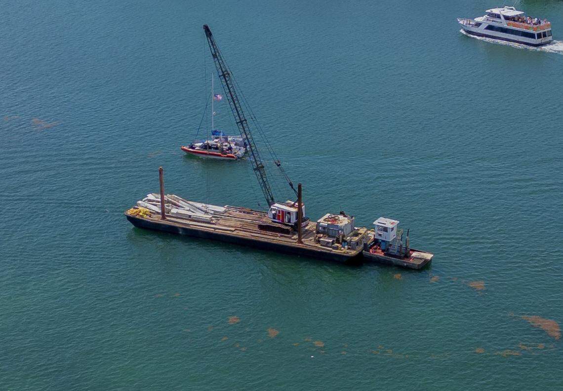 View of a barge that hit a sailboat that sank off Miami Beach’s Hibiscus Island in Biscayne Bay Monday morning, July 28, 2025. Five children and a camp counselor were aboard the sailboat, part of a Miami Yacht Club summer camp. Two children died and two are in critical condition in Jackson Memorial Hospital, the Coast Guard said.