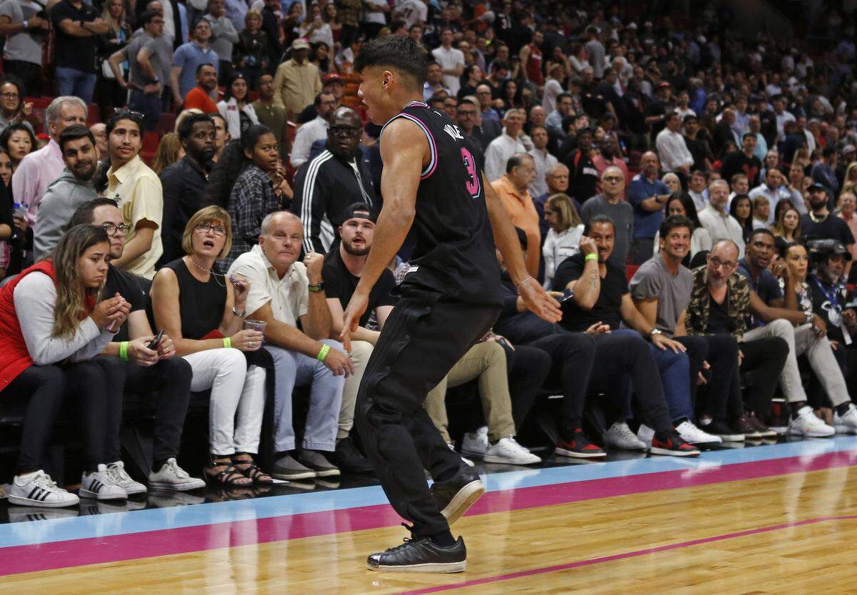 A Miami Heat fan rushed the court in the fourth quarter of an NBA basketball game against the Denver Nuggets at AmericanAirlines Arena on Tuesday, January 8, 2019 in Miami.
