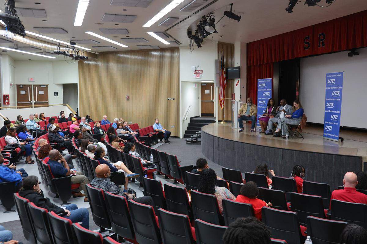 United Teachers of Dade President Antonio White, center, joined by United Teachers of Dade First Vice President Danielle Boyer, left, and United Teachers of Dade Treasurer Mindy Grimes-Festge, speaks about the collective bargaining for the contract as well as the referendum renewal during a town hall meeting moderated by former Florida State Senator Dwight Bullard, far left, at Miami Southridge Senior High School in Miami, Florida, on Wednesday, Nov. 5, 2025.