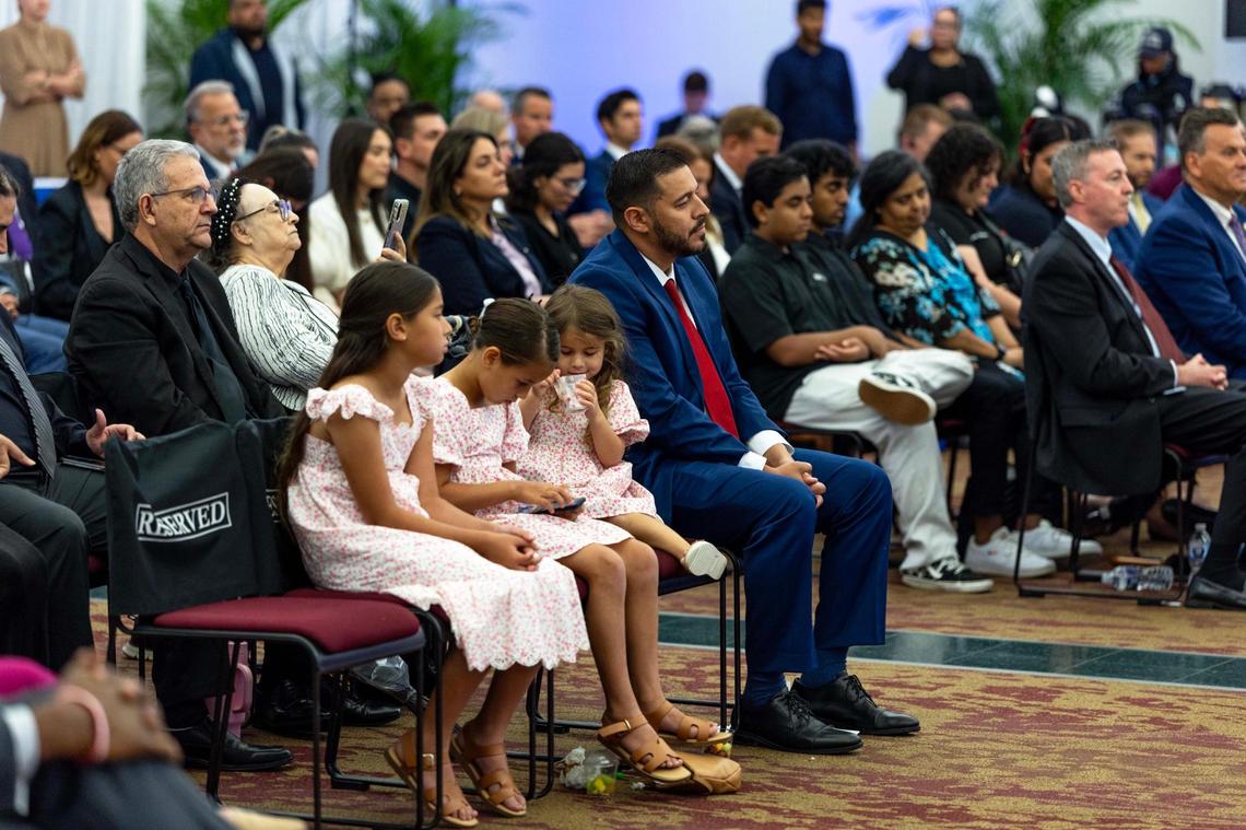 Anastasios “Stasi” Kamoutsas sits next to his children before being selected as the next commissioner of education during a Florida State Board of Education meeting at Miami Dade College Wolfson Campus park on Wednesday, June 4, 2025, in Miami, Fla.