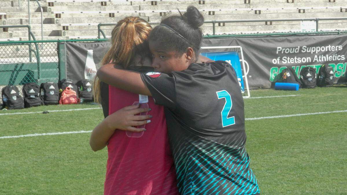 Archbishop McCarthy senior Shannon Scott consoles teammates after the Mavericks lost 1-0 to Montverde Academy in the Class 4A girls’ soccer state championship match on Friday, Feb. 22, 2019.