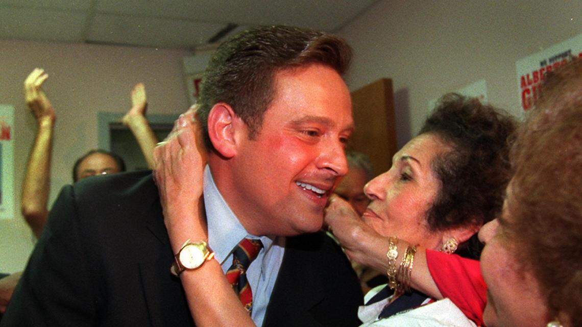 State Representative Al Gutman celebrates with supporters after defeating Gus Garcia to win re-election in 1998.