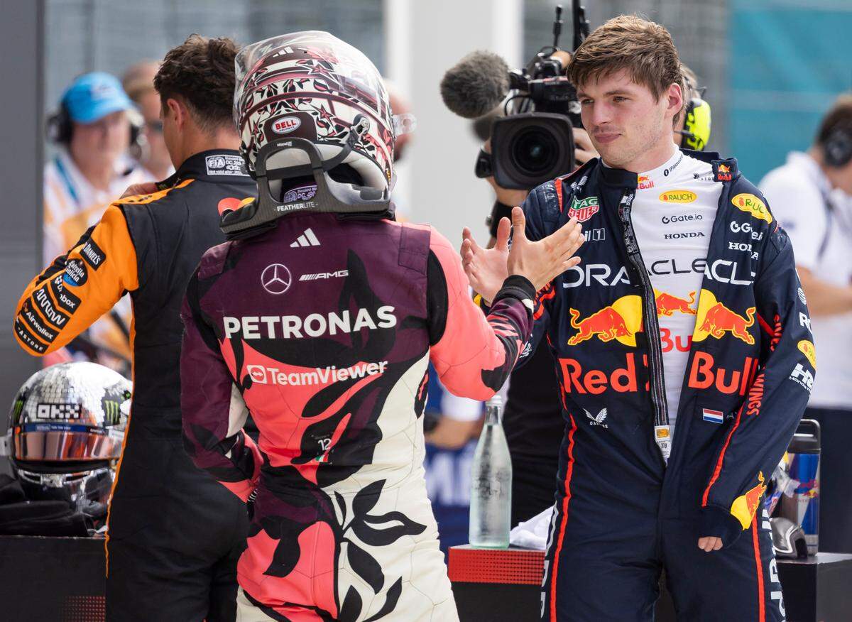 Red Bull Racing driver Max Verstappen of Netherlands and Mercedes driver Andrea Kimi Antonelli of Italy shake hands after they participated in a Race Qualifying session on the second day of the Formula One Miami Grand Prix at the Miami International Autodrome on Saturday, May 3, 2025, in Miami Gardens, Fla.
