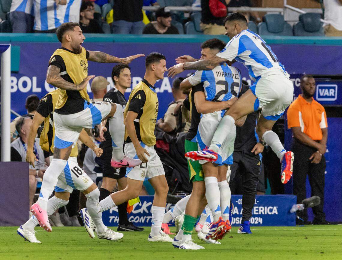 Argentina players celebrates after teammate Argentina forward Lautaro Martínez (22) scoring a goal against Colombia in extra time of the Copa America 2024 Final soccer match at Hard Rock Stadium on Sunday, July 14, 2024, in Miami Gardens, Fla.