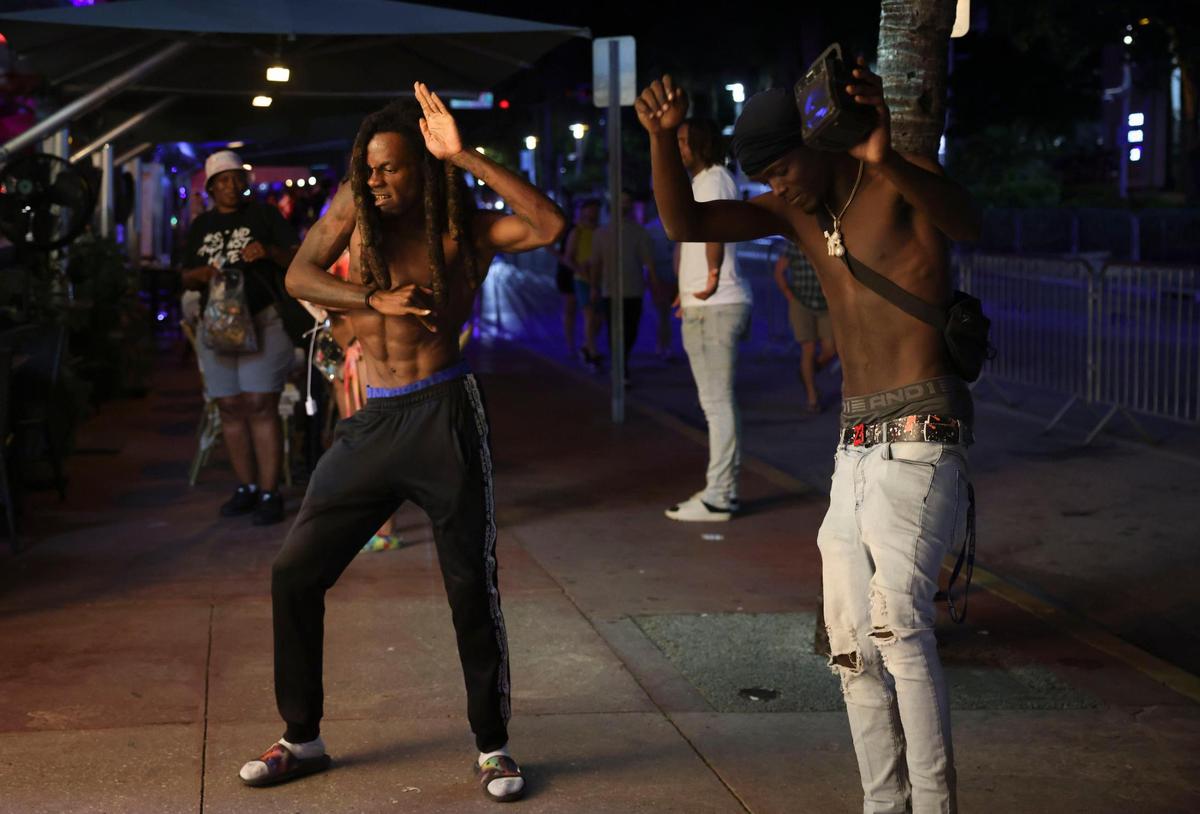 Steven JoTV, a local Miami rapper, left, and 1804 Cowboy, right, film a music video during spring break on Sunday, March 26, 2023, in Miami Beach. Spring break seemed to be coming to a close as fewer people were out and about this weekend.