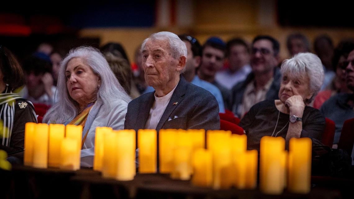 Miami Beach, FL, April 27, 2025 - Holocaust survivor David Schaecter, center, listens to speakers during a ceremony to Commemorate Yom HaShoah, Holocaust Remembrance Day at Temple Emanu-El in Miami Beach.