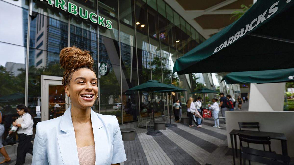 Kylie Russell, CEO and Owner of Priceless One Management stands inside Starbucks at the Brightline Station in Miami, Florida on Tuesday, December 9, 2025. Russell family members license a store of the coffeehouse chain in downtown Miami.