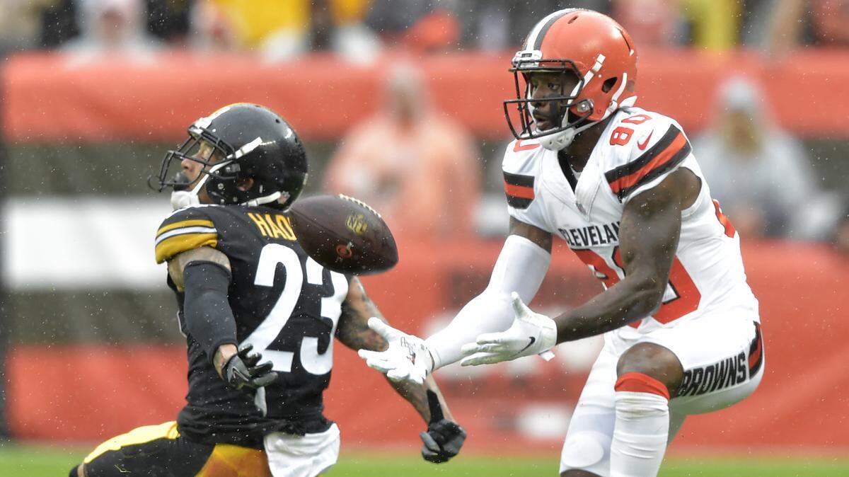 Cleveland Browns wide receiver Jarvis Landry (80) catches a pass for a first down in front of Pittsburgh Steelers defensive back Joe Haden (23) during the first half of an NFL football game, Sunday, Sept. 9, 2018, in Cleveland. (AP Photo/David Richard)
