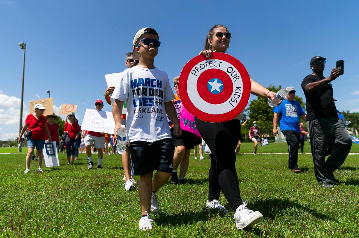 Protestors participate in the March For Our Lives rally at Pine Trails Park on Saturday, June 11, 2022 in Parkland, Fla. One of the main goals of the rally is to increase pressure on politicians to pass laws that help prevent gun violence.
