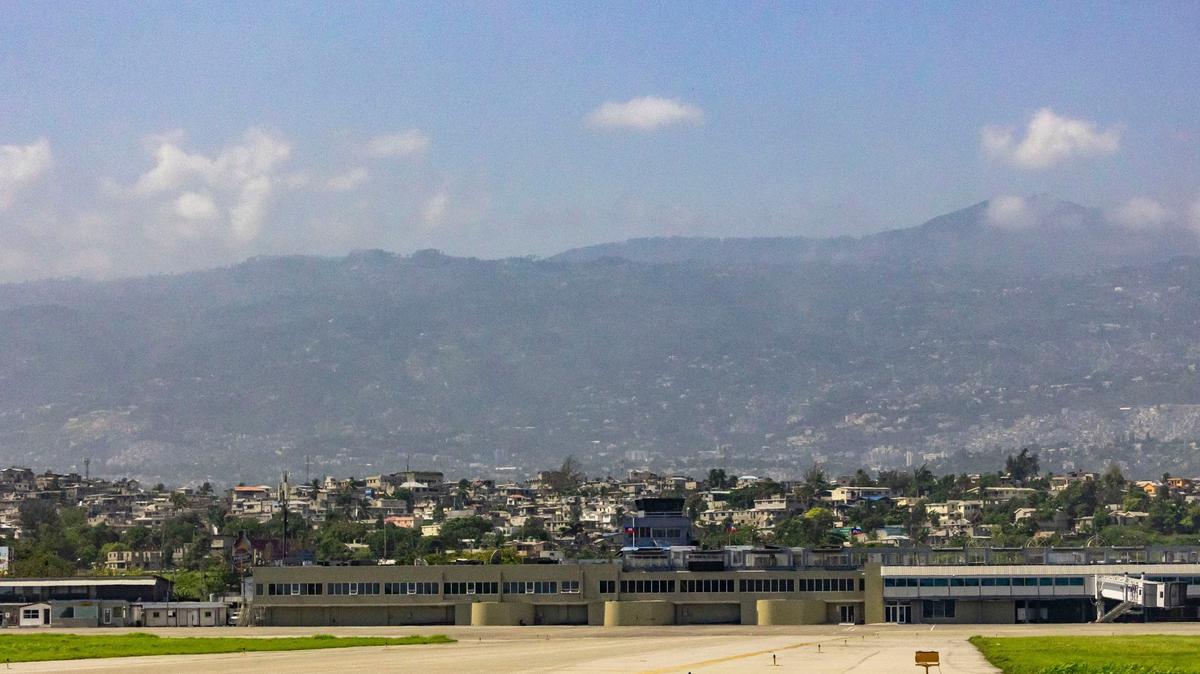 A view of Toussaint Louverture International Airport, foreground, in Port-au-Prince, Haiti. Commercial flights in and out of the airport were suspended in early March 2024 when armed groups targeted the facility and nearby domestic airport.