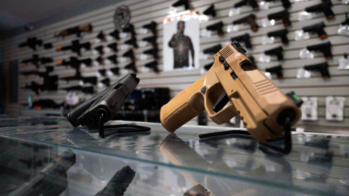 Two hand guns are displayed at Shoot GTR, located at 1610 NW 65th Pl., in Gainesville, Fla., on Sept. 20, 2023.
