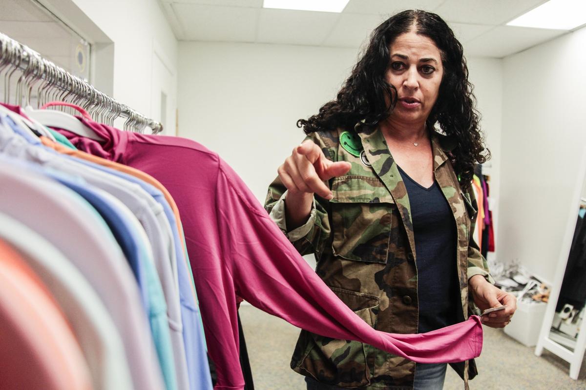MIAMI, FL -- THURSDAY, JUNE 06, 2019-- Corina Biton, founder and president of BloqUV protective clothing line demonstrates the trending colors for the upcoming Spring/Summer season at the headquarters in Miami, Flo., June 6, 2019. (Maria Alejandra Cardona / For the Miami Herald)