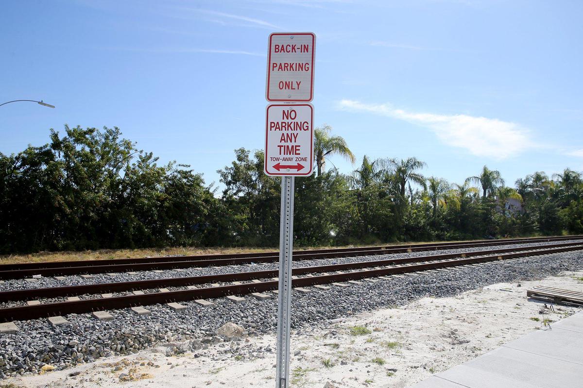 New signs give conflicting instructions along Northeast Fourth Avenue in Little Haiti, where a street improvement project is being criticized for its poor design and safety hazards.