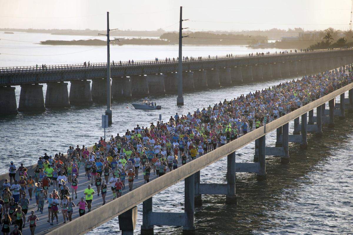 In this aerial photo provided by the Florida Keys News Bureau, the Seven Mile Bridge, near Marathon, Fla., in the Florida Keys is packed with contestants to compete in the Seven Mile Bridge Run Saturday, April 5, 2014. The annual event attracted 1,500 runners who ran over the longest of 42 bridges over water that help comprise the Florida Keys Overseas Highway.