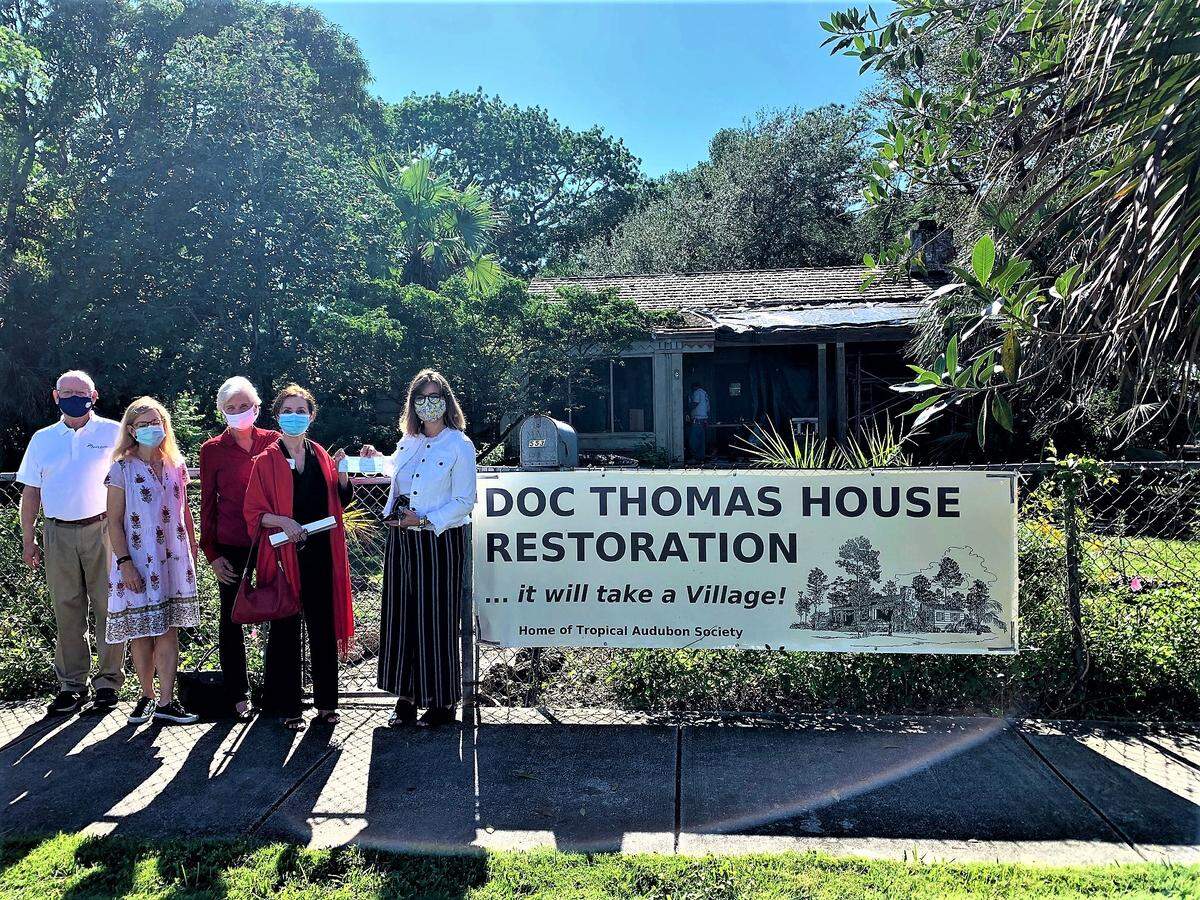 Celebrating at the grant presentation to support renovation of the Doc Thomas House are Tropical Audubon Society Board Member Dan Jones, Villagers Vice President April Matteini, Treasurer Beverly Loftus and President Marie Vacca, and TAS Executive Director Paola Ferreira.