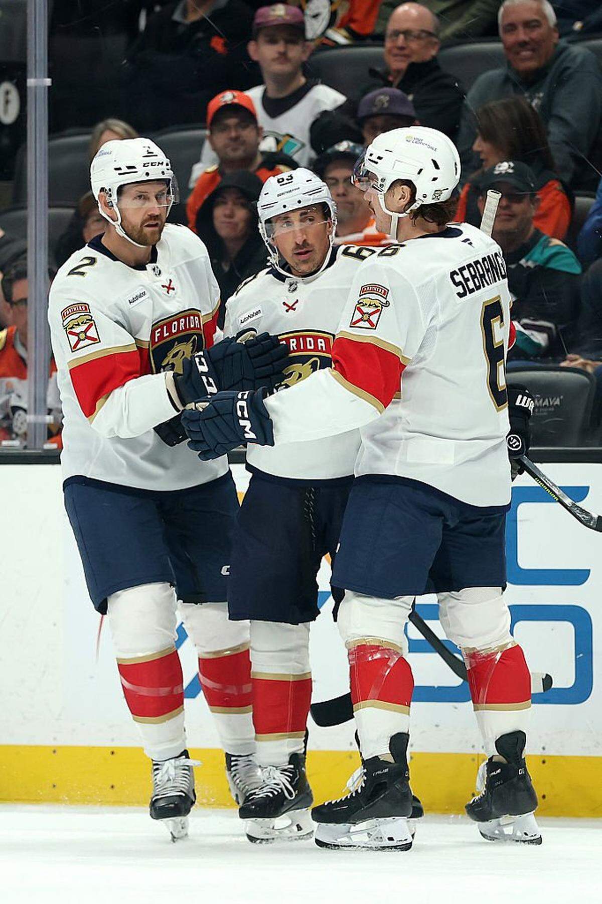 ANAHEIM, CALIFORNIA - NOVEMBER 04: Defenseman Jeff Petry #2 and defenseman Donovan Sebrango #6 congratulate Florida Panthers left wing Brad Marchand #63 after his goal during the first period of a game against the Anaheim Ducks at Honda Center on November 04, 2025 in Anaheim, California. (Photo by Sean M. Haffey/Getty Images)
