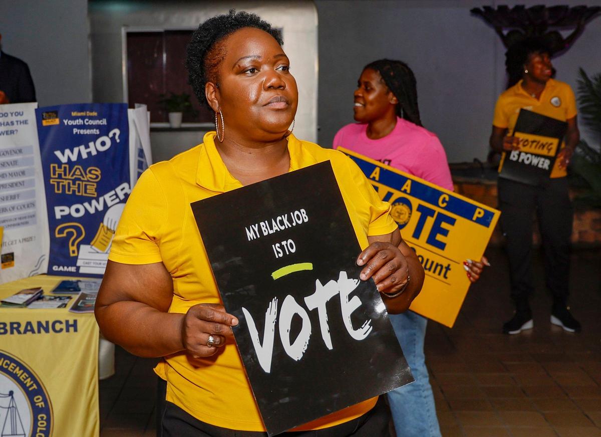 In an effort to register hard-to-reach voters, NAACP’s Miami-Dade Branch president Daniella Pierre stands outside Tootsie’s Cabaret in Miami Gardens on Friday, October 4, 2024.