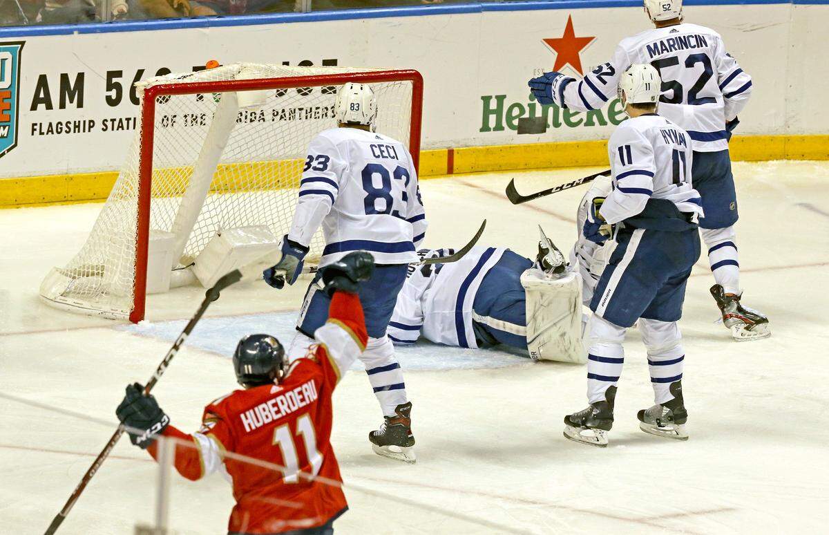Florida Panthers Jonathan Huberdeau (11) celebrates as he assists Mike Hoffman ((68) with a third period goal to help Hunerdeau become the Panthers all time leading scorer as they play the Toronto Maple Leafs at the BB&T Center in Sunrise, Florida, Sunday, January, 12, 2020.