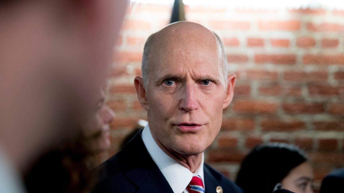 Sen. Rick Scott speaks to reporters outside his office on Capitol Hill in Washington, Wednesday, Jan. 23, 2019.