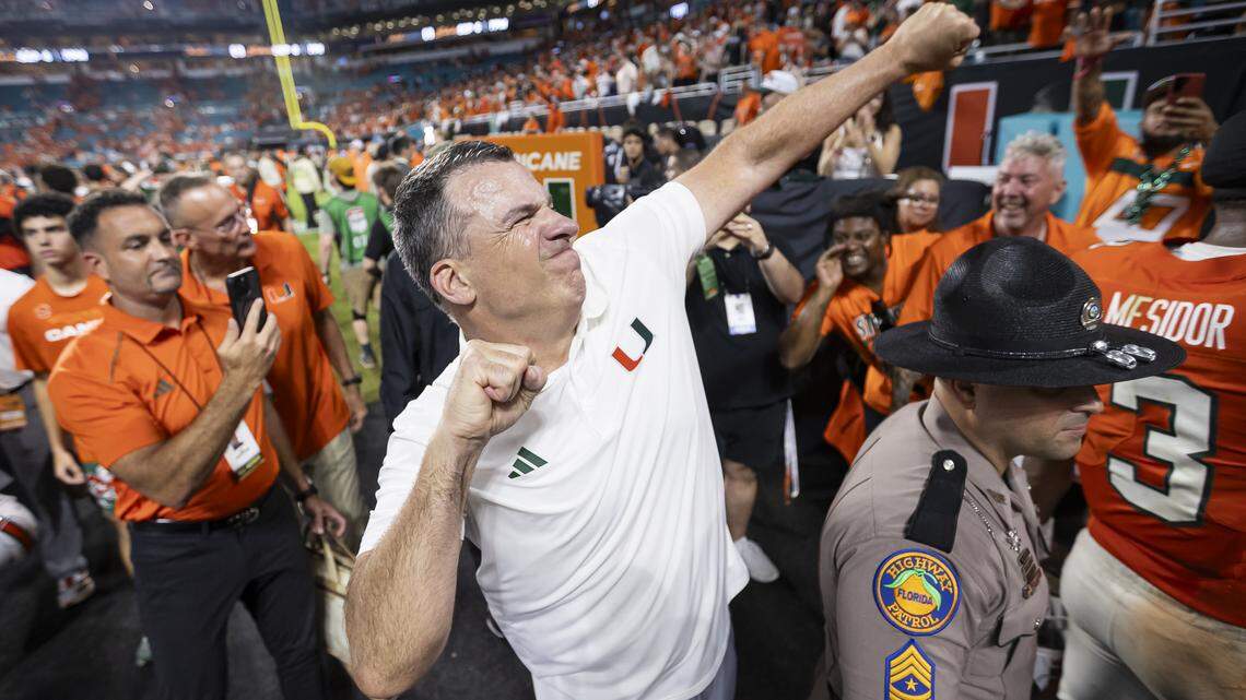 Miami Hurricanes head coach Mario Cristobal celebrates after his team defeated the Notre Dame Fighting Irish in their NCAA football game at Hard Rock Stadium on Sunday, Aug. 31, 2025, in Miami Gardens, Fla.
