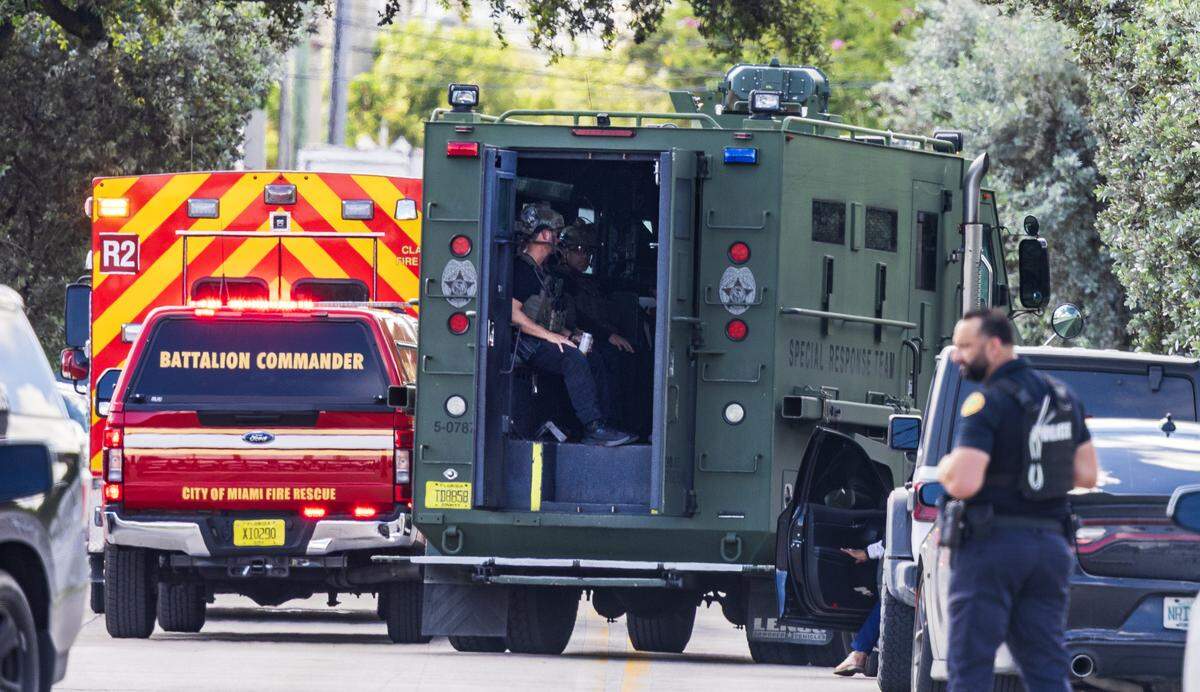 Law enforcement officers with a police special response team are seen on Northwest 14th Avenue and 26th Street as authorities investigate the shooting in Miami’s Allapattah neighborhood on Thursday, Oct. 9, 2025.