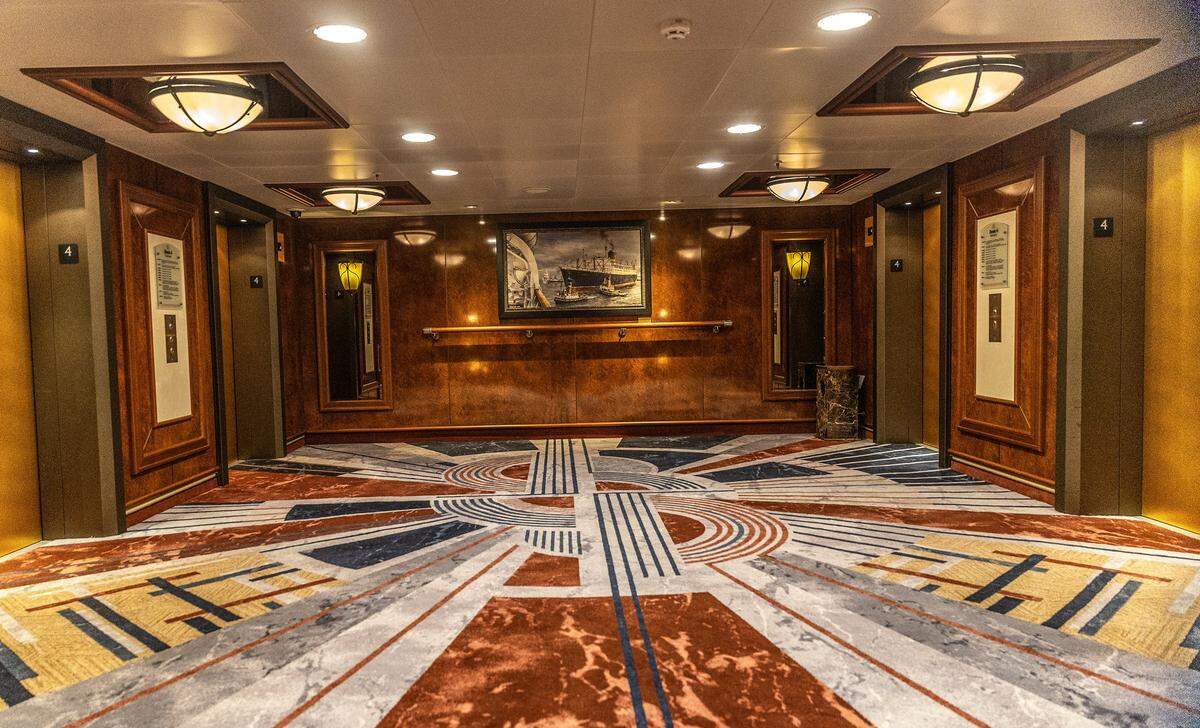 View of a lobby on deck four inside the Cunard cruise ship Queen Elizabeth as it sits docked at PortMiami on Thursday, Oct. 16, 2025, in Miami. The vessel arrived around 6 a.m. and will be based in Miami for six months, offering voyages to the Caribbean. After tours and festivities, the ship is scheduled to depart later Thursday on its inaugural 12-night Caribbean cruise.