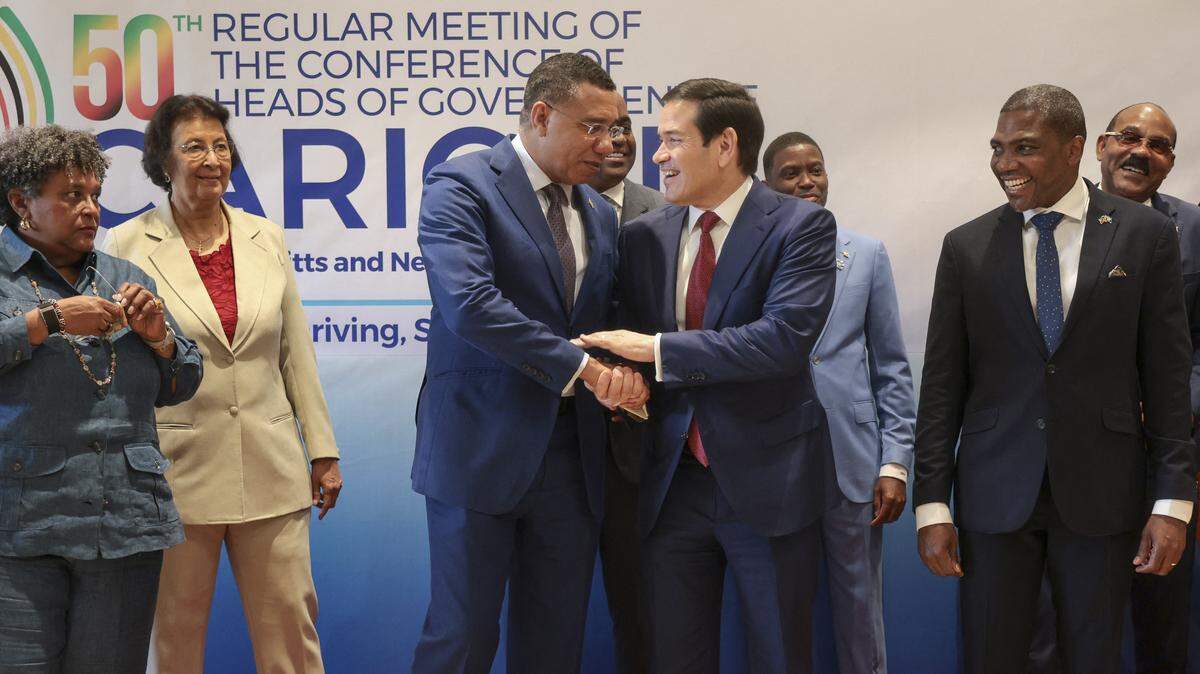 US Secretary of State Marco Rubio shakes hands with Jamaica's Prime Minister Andrew Holness during a family photo with Caribbean Community (CARICOM) heads of government in Basseterre, Saint Kitts and Nevis, February 25, 2026. Rubio is meeting with Caribbean leaders seeking a common line on Venezuela and pressure on Cuba. He's also addressing President Donald Trump's priorities, including combating illegal immigration, drug trafficking and regional security. (Photo by Jonathan Ernst / POOL / AFP via Getty Images)