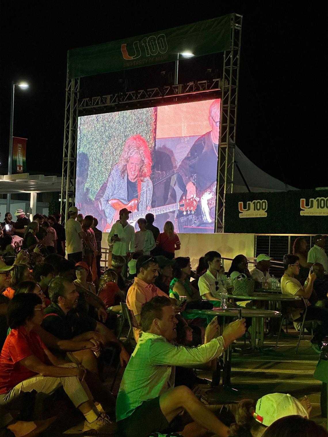 Pat Metheny on the Lakeside Patio video screen as he performs at the University of Miami’s U 100 Centennial concert on April 8, 2025. Seated center is John Pastorius, the son of late jazz bassist Jaco Pastorius who taught at UM in the early 1970s.