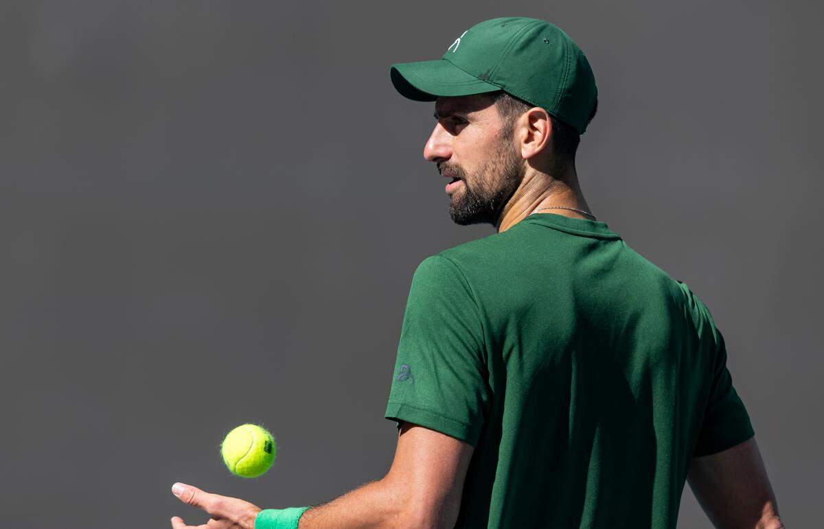 Novak Djokovic, from Serbia, prepares to serve the ball during a practice session at the Miami Open tennis tournament on Tuesday, March 18, 2025, at Hard Rock Stadium in Miami Gardens, Fla.