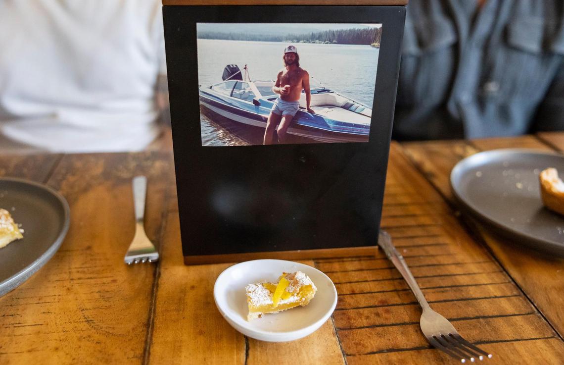 A photo of David Zarco’s roommate’s late, estranged uncle Greg is displayed on a box containing his ashes. In front of the ashes is Uncle Greg’s serving of the meal Zarco cooked based on the recipes Greg left behind.