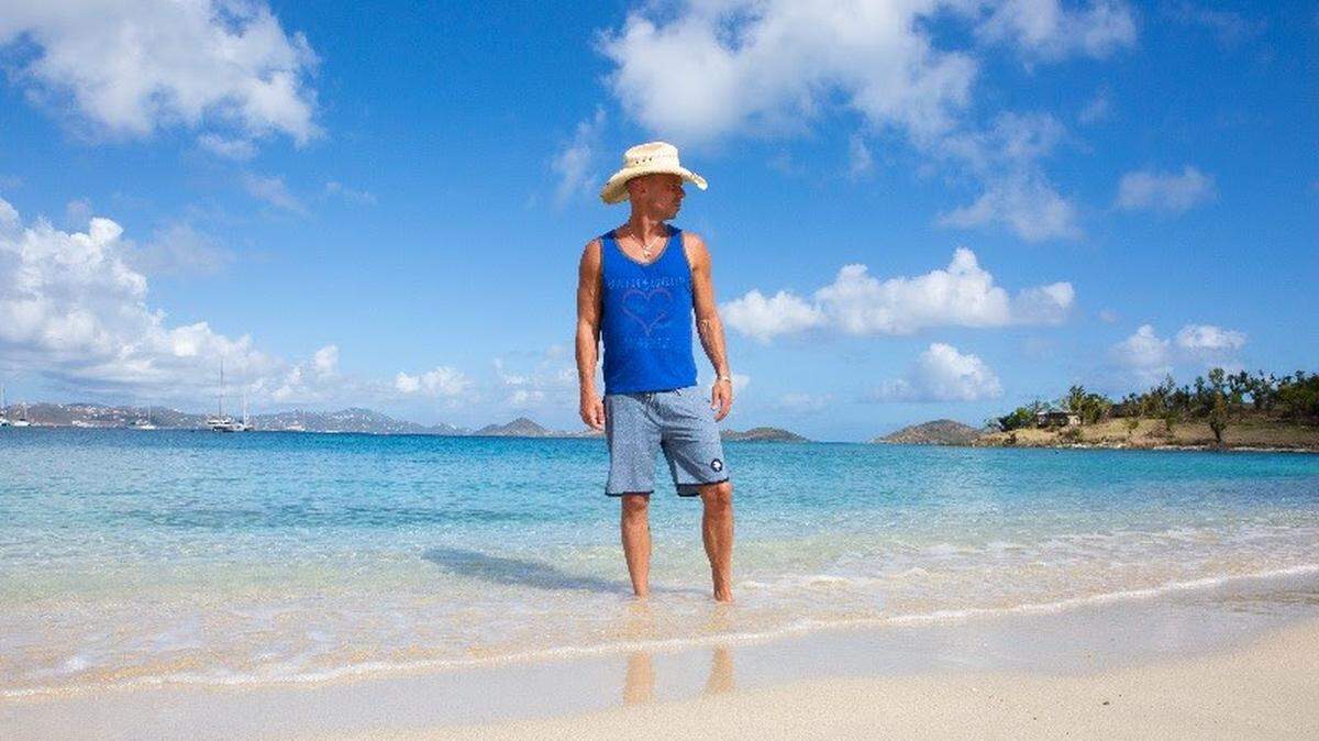 Kenny Chesney and his tour poster image for the Chillaxification Tour 2020, which is opening May 7, 2020, at Coral Sky Amphitheater in Palm Beach County.