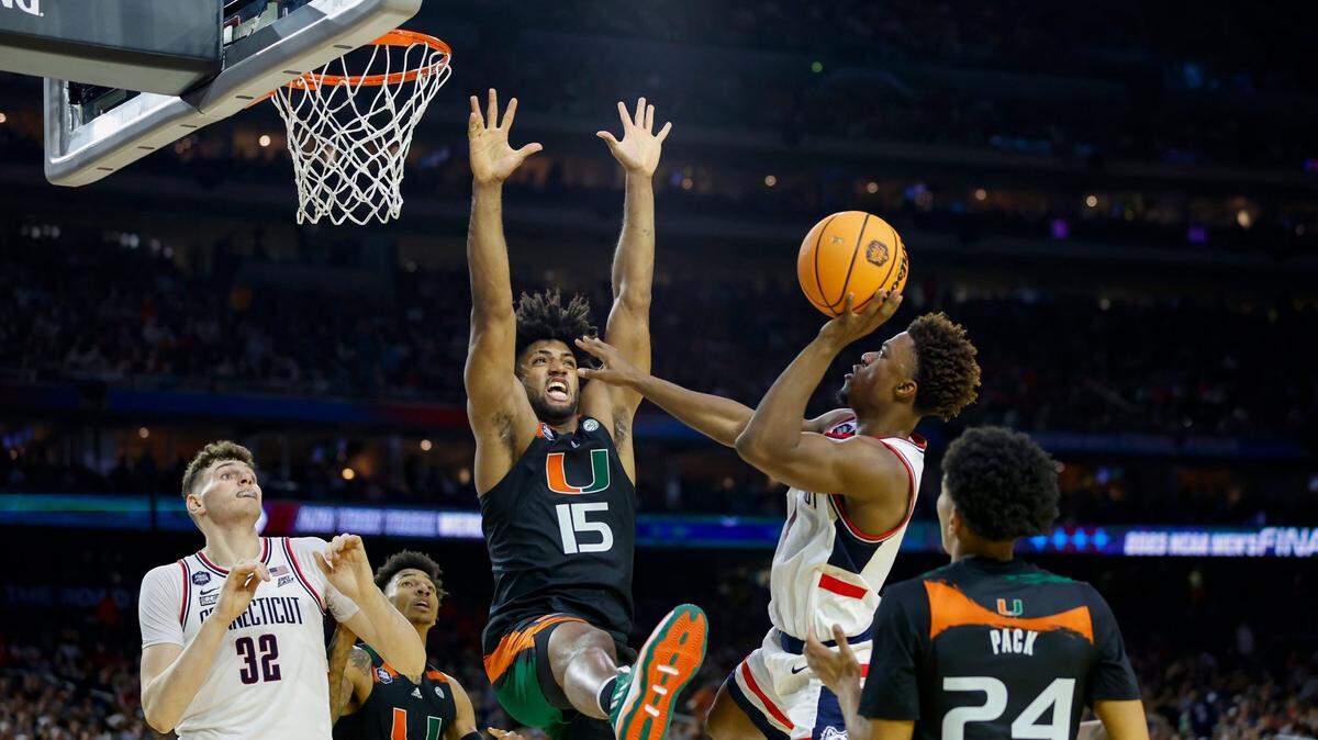 Connecticut Huskies guard Nahiem Alleyne (4) goes to the basket against Miami Hurricanes forward Norchad Omier (15) during the first half of the Men’s Basketball Championship National Semifinal at NRG Stadium in Houston, Texas on Saturday, April 1, 2003.