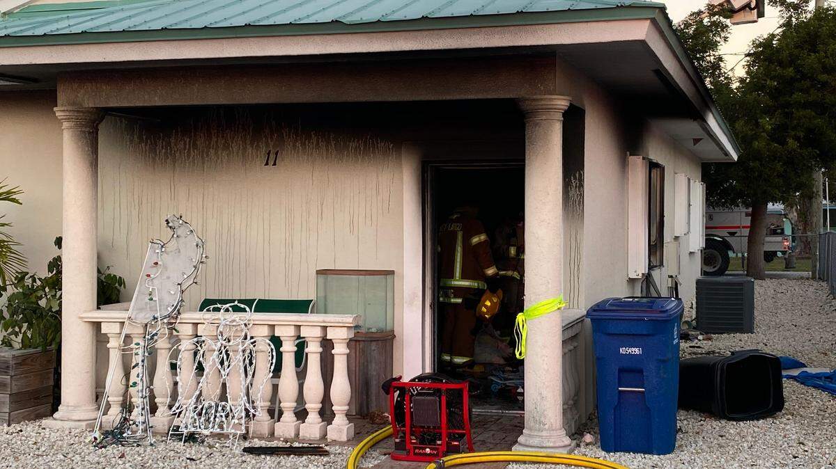Key Largo firefighters knock out the remaining flames of a house fire that forced a family to evacuate their home Wednesday morning, Jan. 22, 2020.