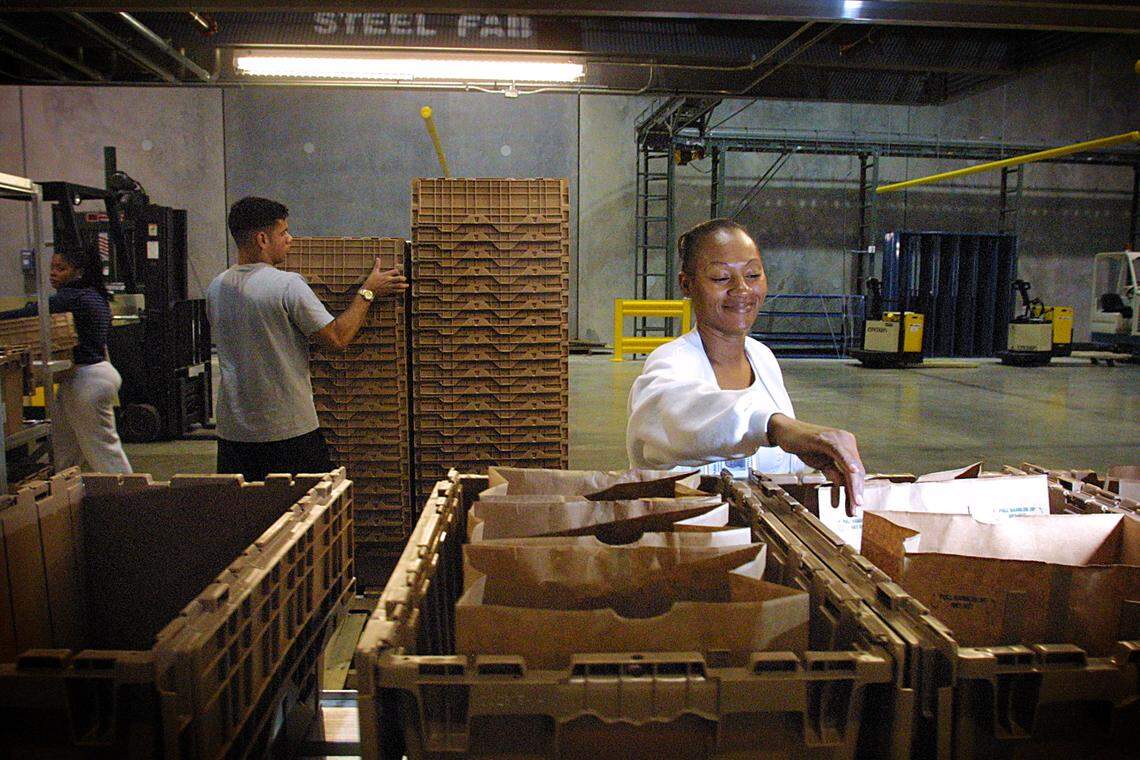 Phyllis Johnson shops for customers at the PublixDirect warehouse.