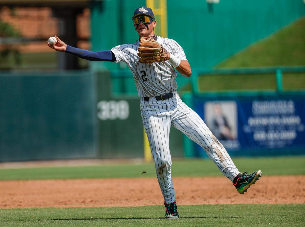 North Broward Prep Eagles Kiernan O’Neill (2) throws to first base to tag out Fort Myers Bishop Verot Vikings Grayson Carpenter (2) in the fifth inning during the FHSAA Baseball Class 3A State Semifinal at Hammond Stadium in Fort Myers, Florida on Tuesday, May 21, 2024.
