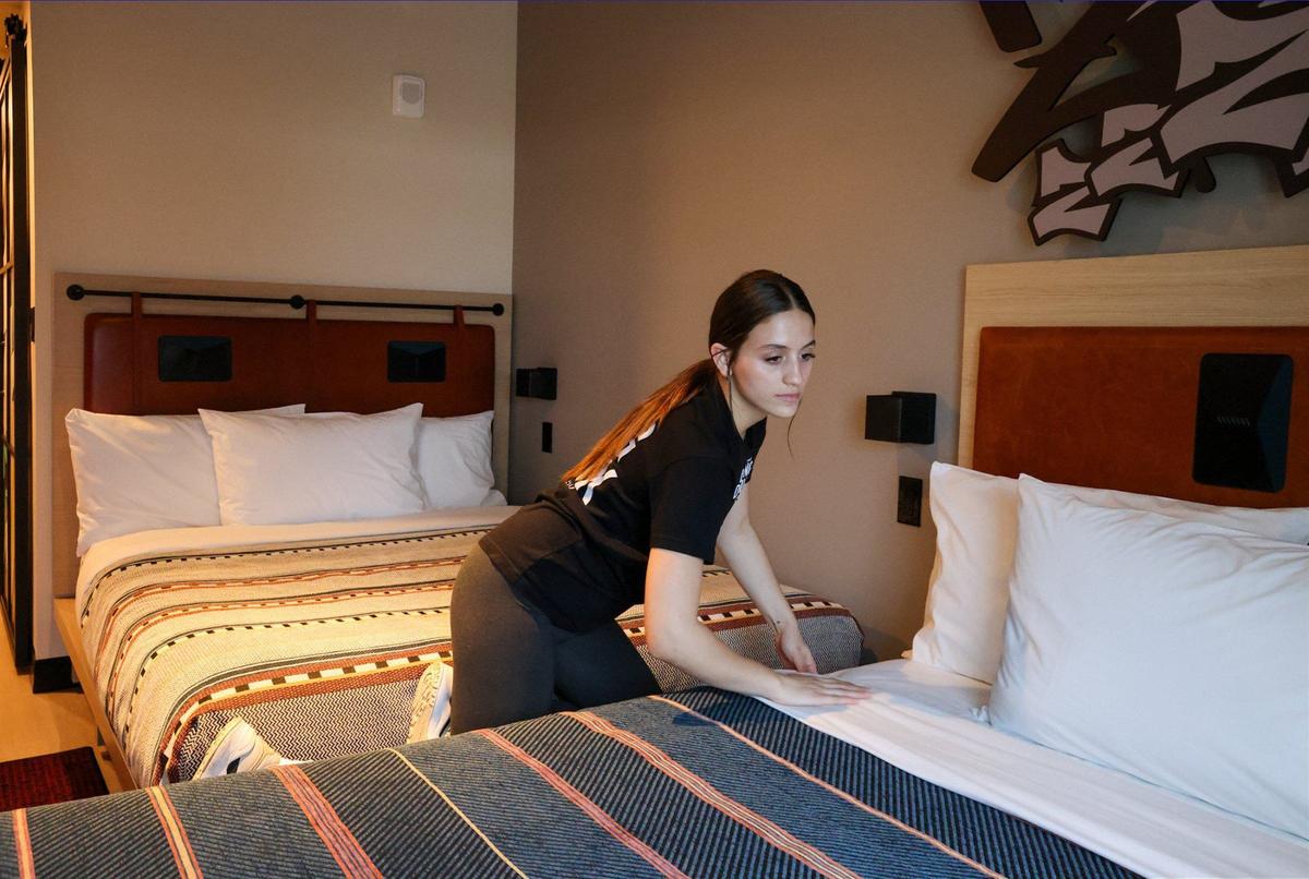 Moxy Miami Wynwood Hotel is close to opening its new location in Miami’s trendy Wynwood Art District. Hotel housekeeper Maria Gonzalez, makes the bed inside the double queen room on Monday, July 29, 2024, in Miami, Florida. The Moxy Hotel features a colorful designs and decor to reflect Wynwood’s artistic and creative spirit, a second-level bar that doubles as a Check-In desk, stylish communal spaces, and innovative touches that create a fun and contemporary ambiance.