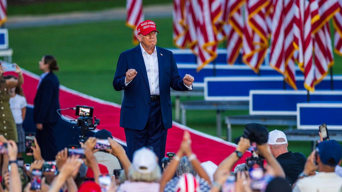Former President Donald Trump reacts as he arrives to the stage during a rally at the Trump National Doral Miami, in Doral on Tuesday, July 09, 2024.